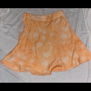 Free people peach combo skirt. Never worn. Size 8.